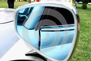 Closeup photo of a car mirror body part