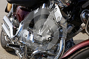 Closeup photo chrome engine and exhaust pipe of the motorcycle