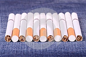 Closeup photo of cigarettes on a jeans background