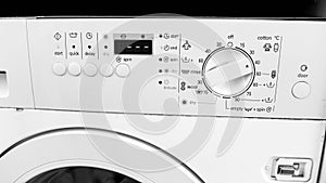 Closeup image of control panel on washing machine at laundry