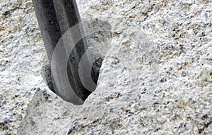 Closeup photo drilling of stone with fissure