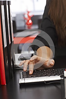 Closeup photo of female hand on keyboard