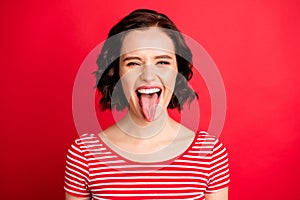 Closeup photo of fooling girlfriend teasing you through camera while isolated with red background