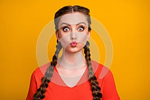 Closeup photo of funny attractive cheerful lady two cute long braids sending air kisses handsome guy playful mood wear