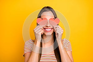 Closeup photo of funny lady holding hands little red paper hearts shy person hiding eyes flirty girlish mood wear casual