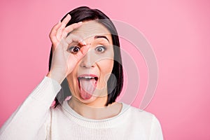 Closeup photo of funny lady showing okey symbol near eyewear childish mood wear white pullover isolated pink bright