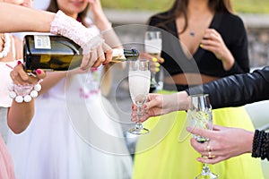 Closeup photo of girls celebrating a bachelorette party with bride