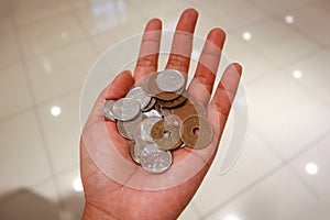 Closeup photo of hand carry Japanese Coin, Financial concept in Japan