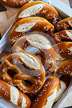 Closeup photo of handmade lye bun and pretzel in bakery photo