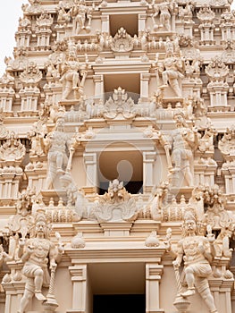 Closeup photo of hindu gods carved on the stone rooftop of hindu temple