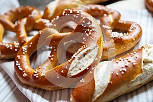 Closeup photo of lye bun and bavarian pretzel in bakery