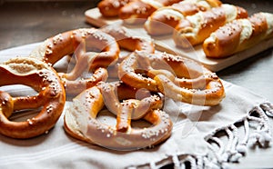 Closeup photo of lye bun and bavarian pretzel in bakery