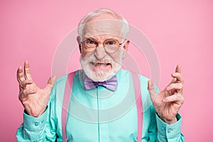 Closeup photo of mad grandpa grimace negative facial expression outraged raise hands grinning wear specs mint shirt