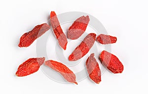 Closeup photo of nine goji berry wolfberry - Lycium chinense dried fruits isolated on white background, view from above