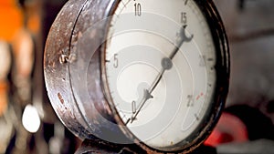 Closeup photo of old vintage analog manometer on steam power machine