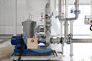 Closeup photo of pipes and tanks. Chemistry and medicine production. Pharmaceutical factory