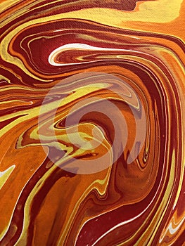 Closeup photo of a pour paint painting.