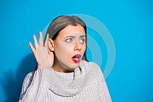 Closeup photo of pretty lady listening concentrated rumours wear knitted pullover isolated blue background