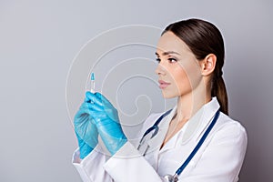 Closeup photo of professional doc serious nurse prepare syringe patient vaccination antibiotic wear latex gloves medical