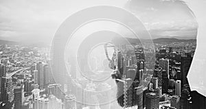 Closeup photo of stylish bearded banker wearing glasses and looking city. Double exposure, panoramic view contemporary megalopolis