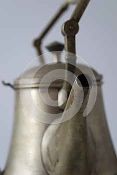 Closeup photo of vintage samovar with glowing brass surface