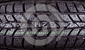 Closeup photo of a wet tire