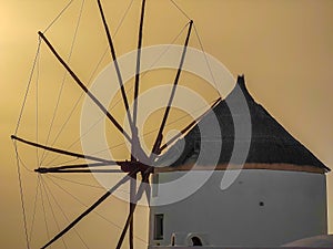 Closeup photo of a windmill in Oia village on Santorini island, Greece