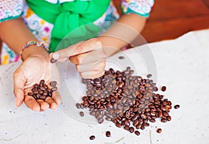 Closeup photo of woman choosing the coffee beans