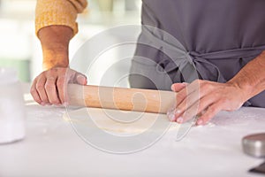 closeup photo woman rolling pastry