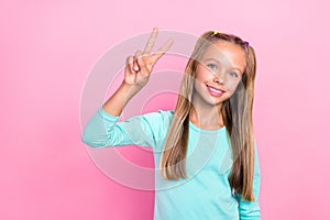 Closeup photo of young little preteen schoolkid girl wear blue shirt toothy smile showing v-sign hello greetings hello