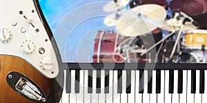 Closeup on Piano keyboard and electric guitar musical instrument