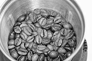 Closeup picture of coffee bean grinder and coffee bean