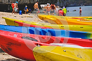 Closeup picture of colourful canoes parking on the beach