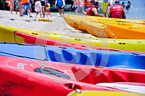 Closeup picture of colourful canoes parking on the beach