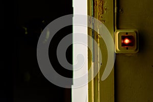 A closeup picture of a light switch and a doorway