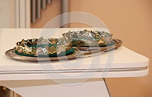 Closeup picture of a pair of shiny wedding tiaras