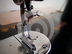 Closeup picture of sewing machine& x27;s niddle