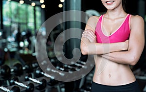 Closeup pictures of young woman in relaxed sports clothing after exercising at the gym