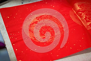 Closeup of a piece of red paper used to write Chinese New Year couplets