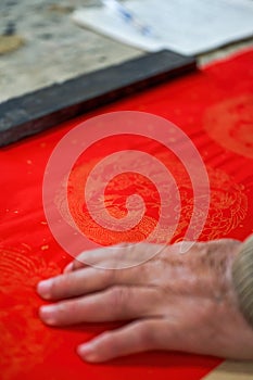 Closeup of a piece of red paper used to write Chinese New Year couplets