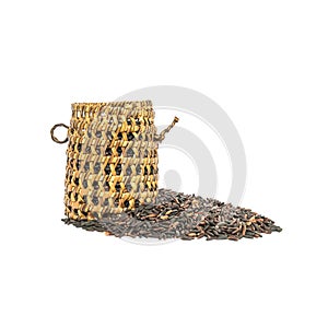 Closeup pile of black rice called riceberry rice with wooden wickerwork, rice with high nutrients isolated on white background wit