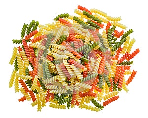 Closeup a pile of colored fusilli type pasta isolated on a white background