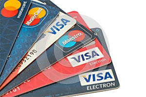 Closeup pile of credit cards, Visa and MasterCard, credit, debit and electronic. Isolated on white background with clipping path.