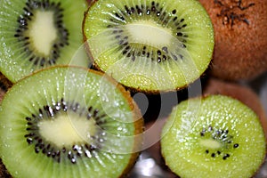 Closeup of a pile of cut kiwi fruits