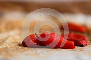 Closeup of a pile of freshly baked piquillo peppers on a rag, in Lodosa photo