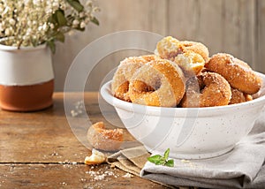 Closeup of a pile of homemade rosquillas, traditional homemade anise donuts from Spain, typically eaten in Easter, on a rustic