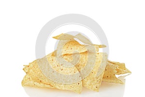 Closeup pile of nacho chips on white