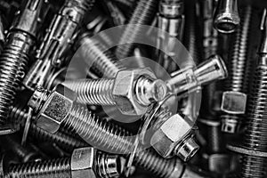 Closeup of Pile of screws and nuts and bolts in a bucket