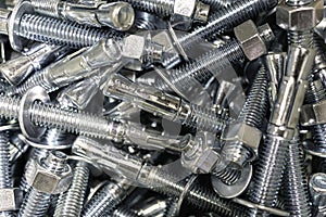 Closeup of Pile of screws and nuts and bolts in a bucket