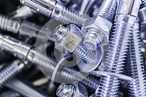 Closeup of Pile of screws and nuts and bolts in a bucket